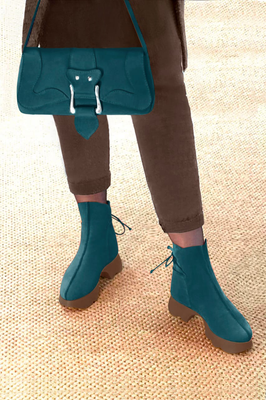 Peacock blue women's ankle boots with laces at the back. Round toe. Low rubber soles. Worn view - Florence KOOIJMAN